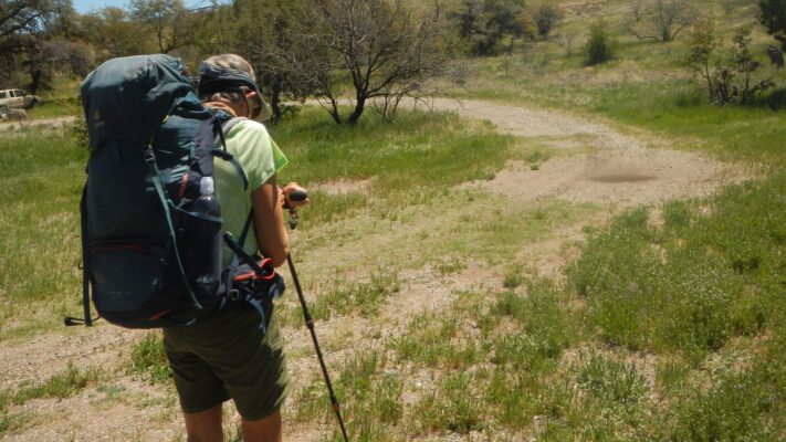 Galiuro Wilderness, Cindy sets Garmin watch at trailhead, 2024 April